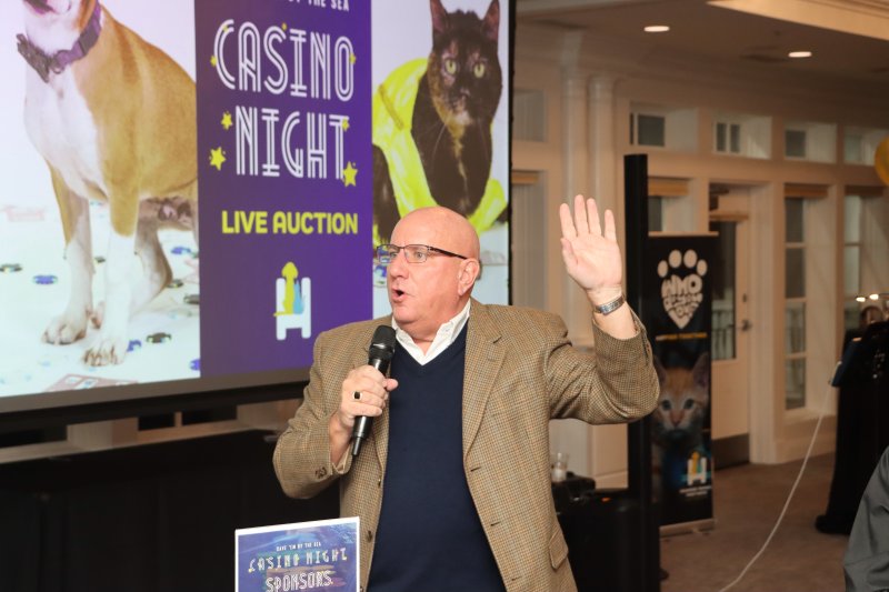 Tom Protack serves as the auctioneer for the evening.